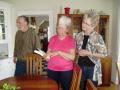 Bill, Gail, Peggy. Inspecting the souvenir book for Pat.