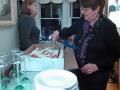 Maryanne, cutting our collective birthday cake.