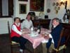 Mary Jane, Fulvio, Dieter<br>sitting down to a meal prepared by Fulvio